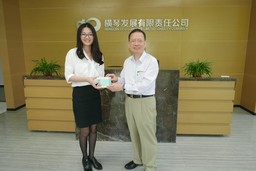 Representative from HengQin Development Limited Liability Company and Dr. L.K.Chu (left to right)